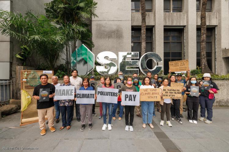 Yolanda survivors protest. Community representatives, including farmers, fishermen, homemakers, youth, senior citizens, and other residents of the Municipality of Salcedo in Eastern Samar, hand-delivered a letter to the Securities and Exchange Commission in Makati City on Nov. 5. (Greenpeace Phils. photo)